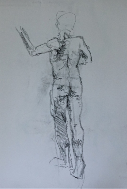 Charcoal figure drawing of a standing man